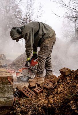 Removal of concrete in preparation for foundation repair project