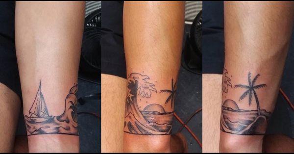 Great fresh ocean scene wristband tattoo done by Bobby