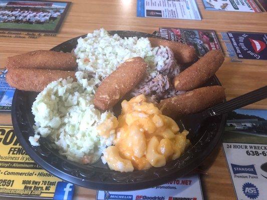 Pulled pork, house slaw, Mac and cheese, and hush puppies.