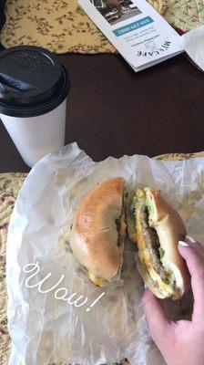 Sausage, egg, and cheese with avocado on a plain bagel.