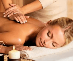 Woman getting relaxing massage. Couples are welcomed!