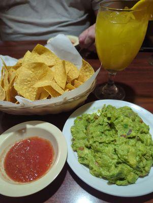 Complimentary chips and salsa, side of guac, mango margarita.