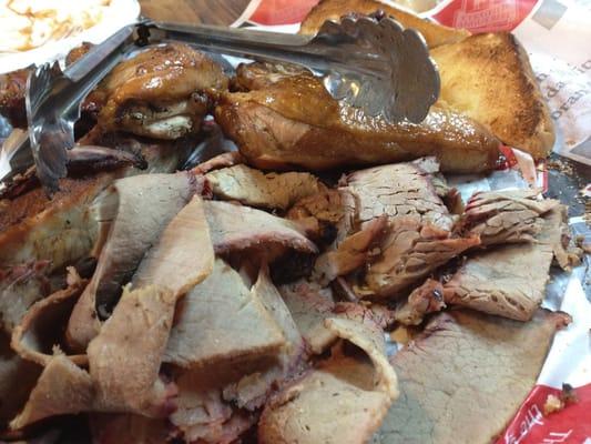 Family meal with ribs, brisket and chicken