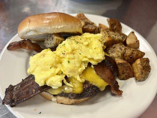 Ultimate breakfast burger with scrambled eggs and country potatoes. My favorite!