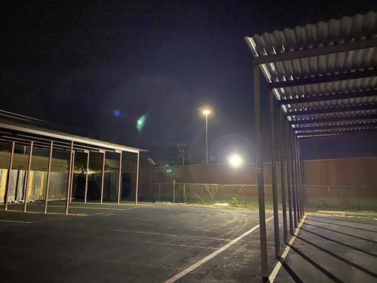 Boat and RV parking area at night. Area is well lit.