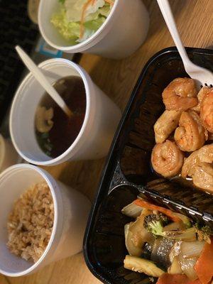 Hibachi shrimp & teriyaki chicken, mixed vegetables (Broccoli, Mushrooms, Zucchini, Carrots, onions), fried rice, clear soup, and salad.