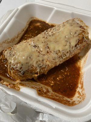 Wet burrito with obviously red sauce chicken beans and rice !!!