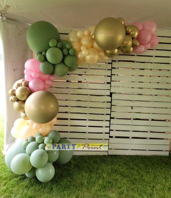 Balloon organic arch. Organic swag on pallet. Elegant celebration balloons