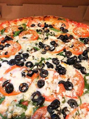 Greek pizza....not stingy with the olives. Yummy!