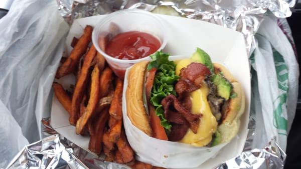 Avocado bacon cheeseburger with sweet potato fries