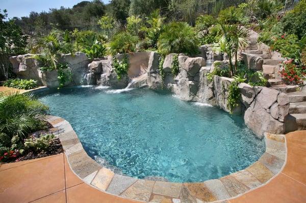 Flagstone coping, pebble finish and waterfalls.