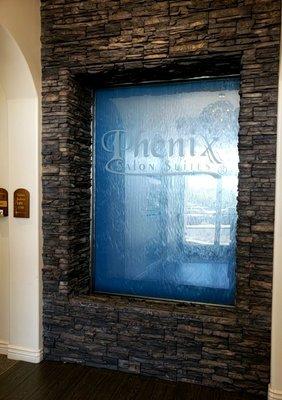 New location is the suite just to the Left of the Phoenix salon suites fountain sign