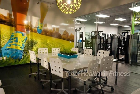 The conference room for diet and weight loss seminars... and a view of the gym and fitness equipment for personal training.