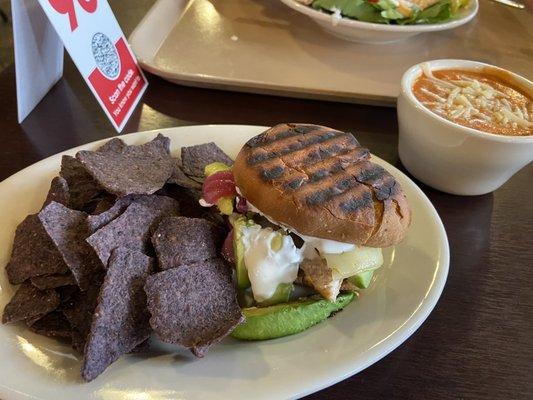 Chipotle chicken half sandwich with soup and chips