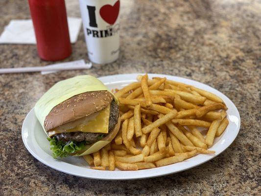 Tasty ass cheeseburger and some bad ass fries.