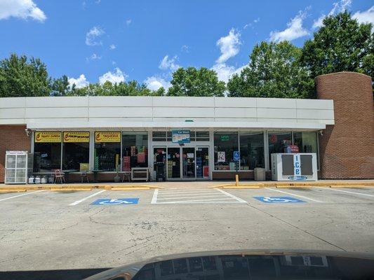 Outside the convenience store. Storefront. There's a taqueria inside.