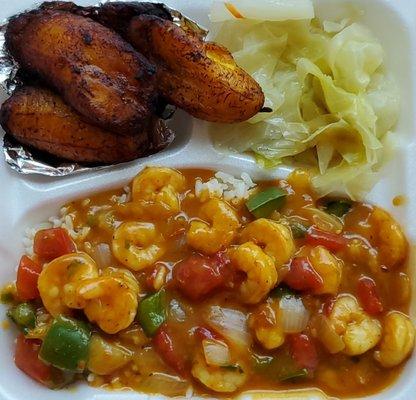 Smothered shrimp over rice. Cabbage and plantains as side items.