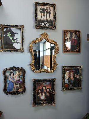 Famous witches in photo frames with a mirror showing that you are the next famous witch.