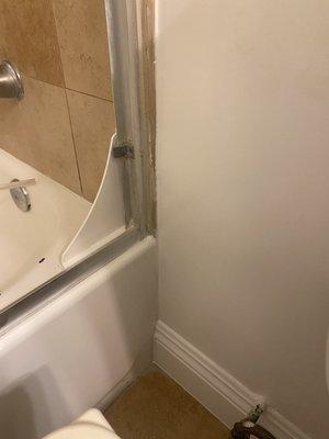 After identifying the source of the water leak, the bath tub was caulked and dry wall was replaced.