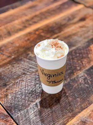 Drinking chocolate float (hot drinking chocolate with a scoop of ice cream, topped with whipped cream and a shake of cocoa).