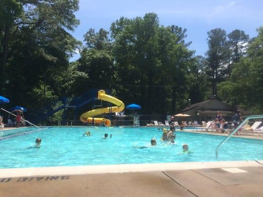 Big pool, slide and diving board. Playground.