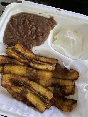 Plantains with refried black beans and creama.