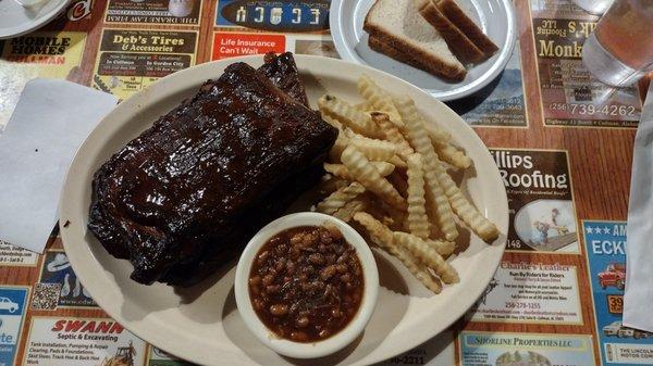 Ribs with fries, baked beans and bread. Was really good