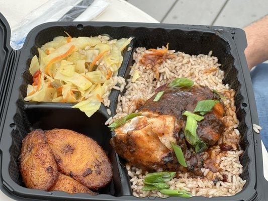 Jerk chicken with rice and beans, plantains and cabbage.