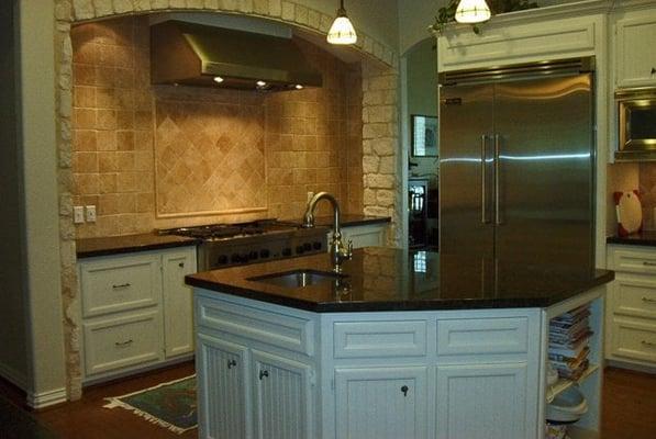 Complete kitchen remodel. New granite, under mount sinks, cabinets, stove and vent hood, backsplash, and refrigerator