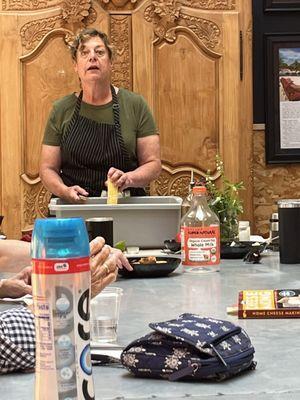 Cooking instructor making a Mexican street corn side dish