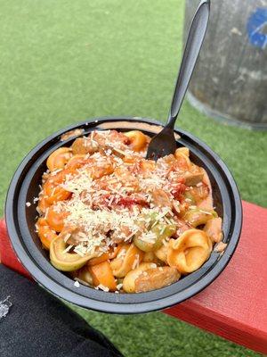 Cheese tortellini with Pink 50/50 sauce, sun dried tomatoes and sausage.