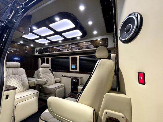 Mercedes Sprinter Interior. 4 Captain chairs and 2 bench seats.