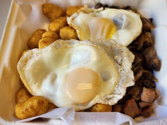 Amazing Breakfast Gnocchi with asiago-stuffed gnocchi, mushrooms, pancetta, and topped with fried eggs!