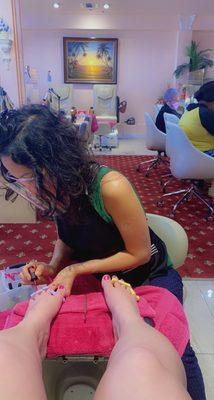 Cynthia finishing up my toes!