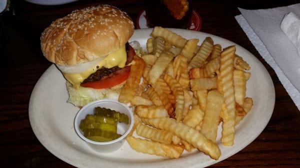 Cheese Burger and fries with " a couple of cheap ass pickle slices "