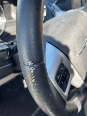 Damage to steering wheel caused by service team.