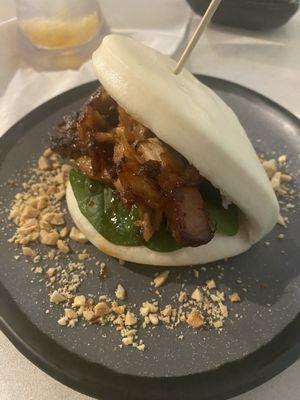 Beekon Bao with teriyaki, pork belly, mint, and peanuts