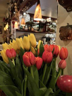 Fresh flowers along the bar