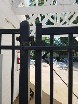 Automatic closer installed on a pool gate.