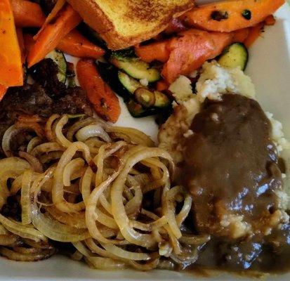 Liver / fried onions with a side or brown gravy.  Chunky smashed potatoes,sauteed mixed veggies, and garlic toast.