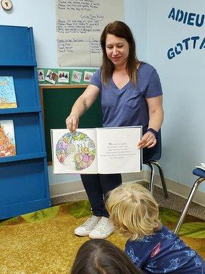 Teacher Julie reads to the kids