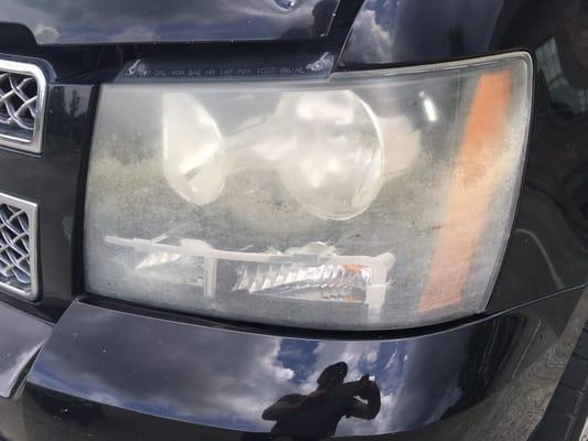 2007 Chevy Tahoe LTZ badly damaged, yellowed before restoration.