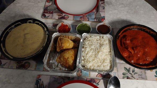 Paneer korma, samosas, and chicken vindaloo