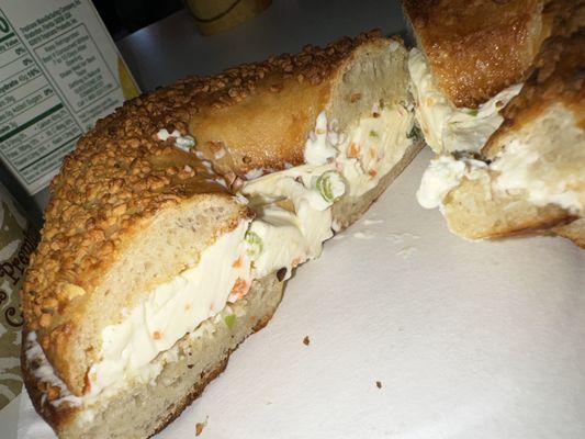 Garlic bagel toasted w/ vegetable cream cheese, orange juice, and coffee