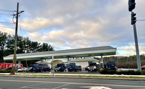 a rare and elusive flock of amazon prime vans photographed in the wild - had to go to another cumbies because gas was sold out