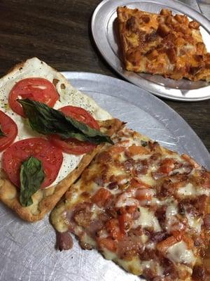 Ranch, buffalo, and  mozzarella tomato pizza squares.