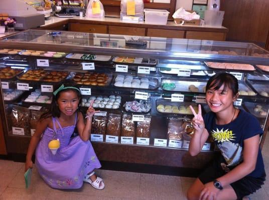 The display case of sweets (couldn't resist the Asian tourist pose; youngest can't quite get a "shaka" right)