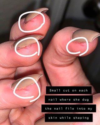 Small cuts on each nails where she dug the file into my skin while shaping.