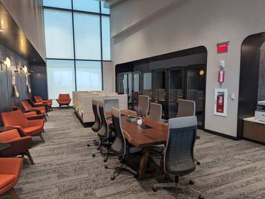 Conference area with private booths for phone conversations.