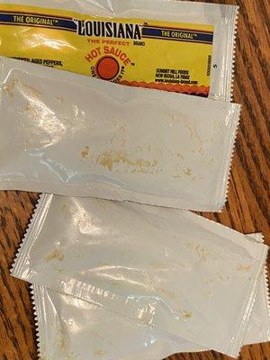 Dirty hot sauce packets